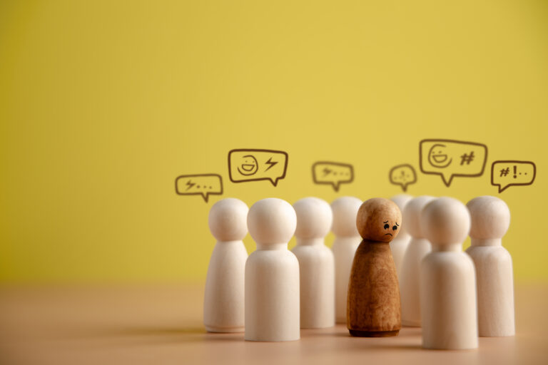 bullying racist concept world social issue sad person being bullied from others parody intimidation doing saying bad presenting by wooden peg dolls