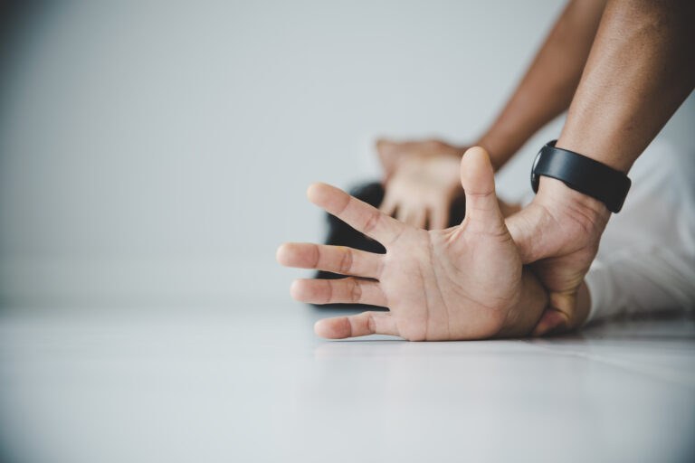 close up man hands holding woman hands rape sexual abuse concept