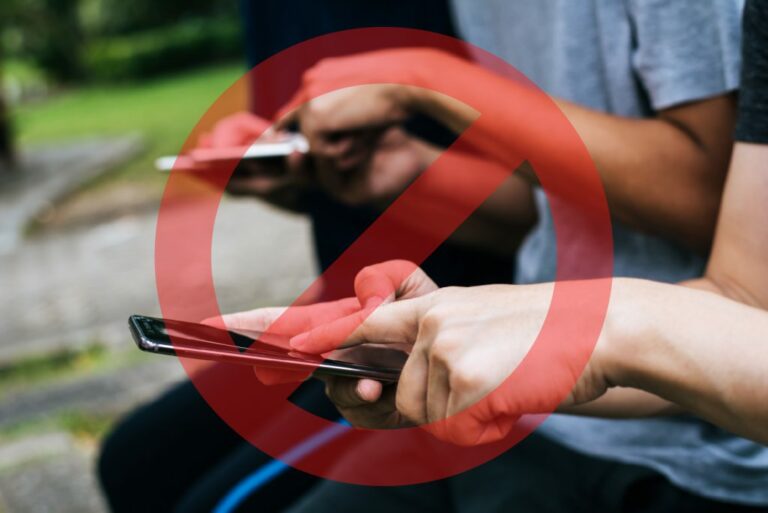 close up friends hands play with smartphone together 01 1024x684 1