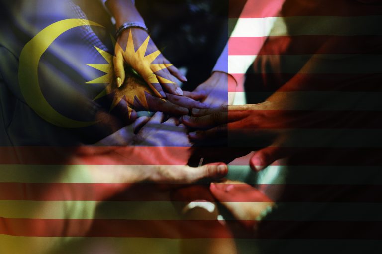 group young friends stacking hands 01